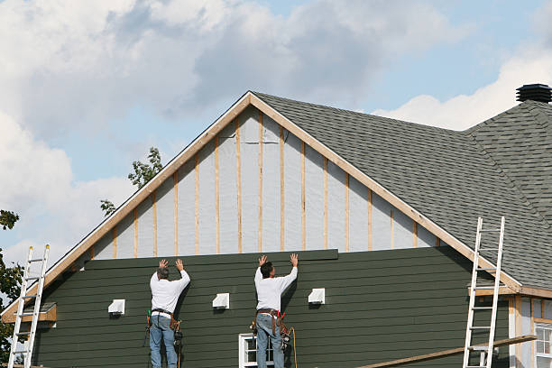 Professional Storm Damage Siding Repair technician working in Freeland, PA